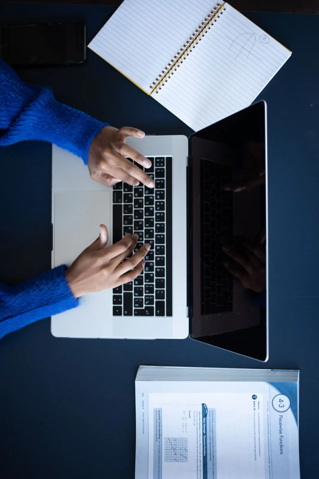 Working through fixed-price AI SEO plans on a laptop